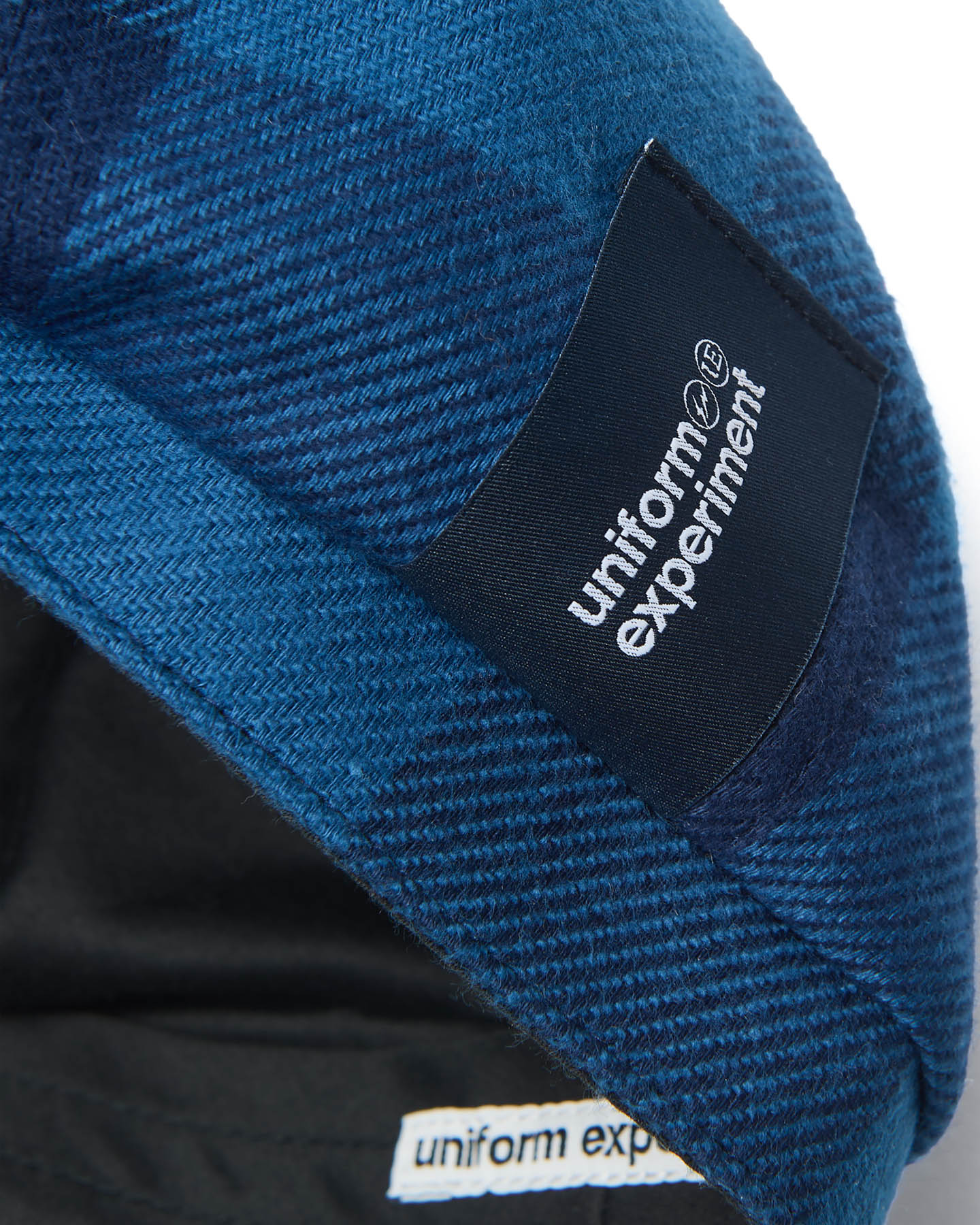uniform experiment / FLANNEL CHECK NEWSBOY CAP (blue) タグ